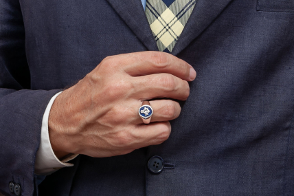 Man in suit wearing masonic ring