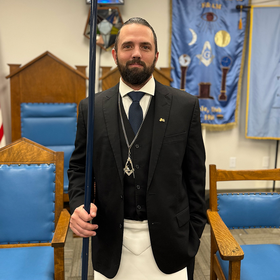Chris Van Steeter as the Junior Deacon